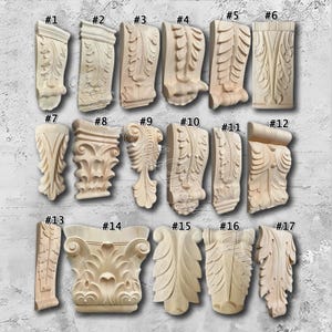 May include: Seventeen unvarnished, carved wooden architectural details are displayed, each with a distinct design. The pieces are numbered and feature various leaf and scroll patterns, suitable for home decor or woodworking projects.