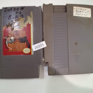 May include: A set of three ceramic mugs with a speckled, matte finish. The mugs are in shades of cream, light gray, and dark gray. Each mug has a simple, minimalist design and a rounded handle. The mugs are stacked on top of each other.