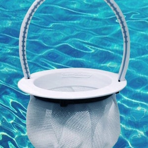 May include: White plastic pool skimmer with a blue handle. The skimmer has a mesh bag for collecting debris.