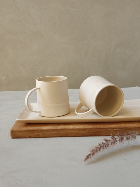 Porcelain coffee mugs with matte white finish · Handmade Ceramic