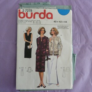 May include: A Burda sewing pattern for a three-size dress and jacket. The pattern is for sizes 40, 42, and 44. The dress is black with a V-neck and the jacket is a floral print. The pattern is available in sizes 14, 16, and 18.