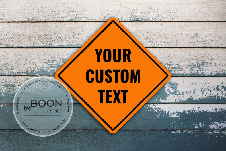 May include: Orange diamond-shaped road sign with a black border and black text that reads "YOUR CUSTOM TEXT". The sign is mounted on a weathered wood background.
