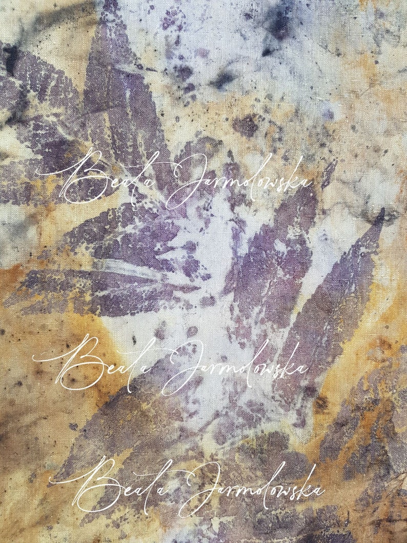 May include: A close-up of a fabric with a mottled purple and brown pattern. The name "Beata Jarmolowska" is written in white cursive script three times.