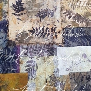 May include: A collage of fabric squares with a botanical theme. The fabric is a light brown color with a pattern of leaves and branches. The fabric is stitched together with a decorative stitch. The artist's name, "Beata Jarmolowska", is written in cursive on the fabric.