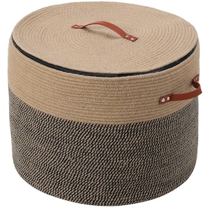May include: A round storage basket with a lid, constructed from coiled rope. The top half is tan, while the bottom half features a black and tan diagonal weave. It includes two brown faux leather handles with silver rivets on the lid and side.