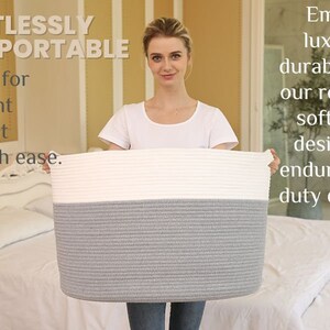 May include: A woman holds a large, gray and white rope storage basket. The basket is made of thick, woven rope and has a white top and a gray bottom. The text "Effortlessly Transportable" is in the top left corner of the image. The text "Designed for convenient mobility, it glides with ease." is in the bottom left corner of the image. The text "Embrace luxurious durability with our robust yet soft fabric, designed to endure heavy-duty demands." is in the top right corner of the image.