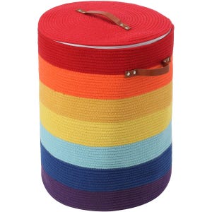 May include: A cylindrical storage basket constructed from coiled rope featuring horizontal stripes in red, orange, yellow, light blue, dark blue, and purple. The basket includes a matching lid with a brown leather handle and side handles.