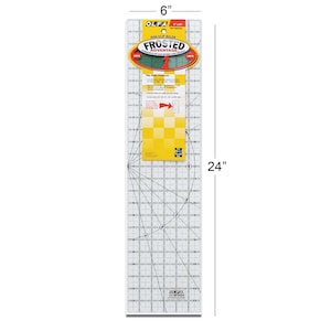 May include: A clear, rectangular OLFA Frosted Advantage non-slip ruler, 15.24 cm wide and 60.96 cm long. The ruler features a grid pattern with measurements in inches and a yellow and white label with product information.