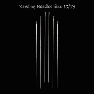 May include: A set of six silver beading needles, size 10/13, arranged vertically against a black background.