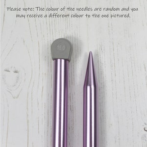 May include: A pair of purple knitting needles, one with a gray tip marked "15.0".