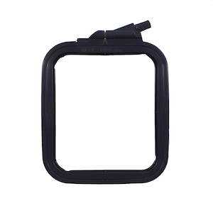 May include: A black plastic embroidery hoop with a square opening. The hoop has a screw-on mechanism for tightening the fabric.