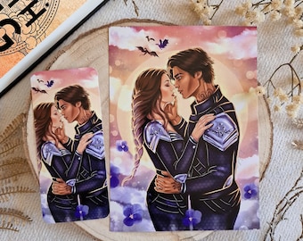 May include: A romantic illustration of a couple embracing, with a purple and blue color scheme. The woman has long, flowing hair and is wearing a silver and black outfit. The man has short, dark hair and is wearing a black and silver outfit. The background is a soft, pink and orange sunset with clouds and flying bats.