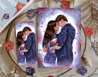 May include: A bookmark and print featuring an illustration of a couple in an embrace. The artwork shows a tender moment, set against a soft, dreamy backdrop with falling petals. A book with the title "Jenny Han" is visible.