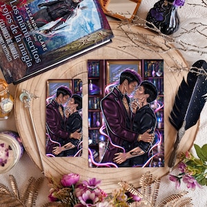 May include: A rectangular art print and a matching bookmark featuring an illustration of two individuals embracing in a library setting, surrounded by glowing pink energy lines. The artwork depicts a person in a dark purple blazer and another in black.