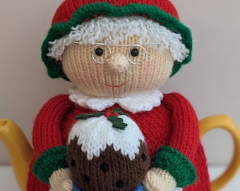 Tea cosy knitting pattern. PDF digital download. Mrs Claus tea cosy knitting pattern for a 6 cup teapot. Knitted flat. ENGLISH ONLY.