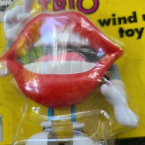 Vintage 1988 Nasta Tang Trio Wind up toy.
