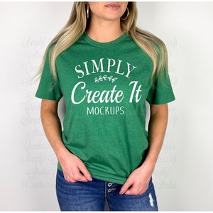 May include: A green t-shirt with the text "SIMPLY Create It MOCKUPS" in white lettering. The shirt is being worn by a person with long blonde hair.