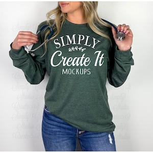 May include: A dark green long-sleeved shirt with the text "SIMPLY Create It MOCKUPS" in white. The shirt is being worn by a person with a stethoscope around their neck.