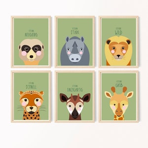 May include: Six framed prints with green backgrounds and animal illustrations. Each print features a different animal and a German phrase describing the animal's personality. The animals are a meerkat, rhinoceros, lion, cheetah, okapi, and giraffe.