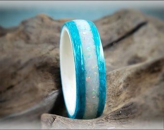 Ipe and maple bentwood ring with blue camo stone inlay