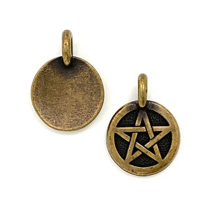 May include: Two antique gold-toned metal charms. One charm is a circle with a smooth surface. The other charm is a circle with a pentagram design.