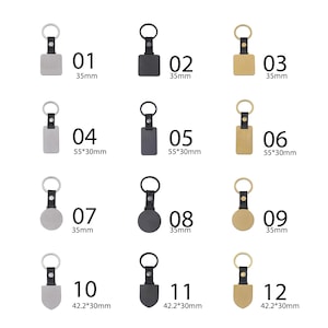 May include: A collection of twelve keychains with various shapes and finishes. Each keychain features a metal tag attached to a black leather strap and a silver keyring. Sizes are indicated in millimeters and inches.