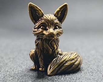 May include: A detailed bronze fox figurine in a seated position, featuring intricate fur detailing and a bushy tail. The fox has large, upright ears and a focused expression. The figurine is a decorative item, likely for display or collection.