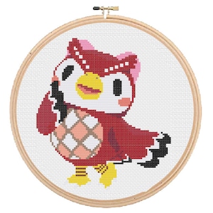 May include: Cross-stitch embroidery hoop featuring a red owl with yellow beak and feet, black eyes, and a pink bow. The owl is on a white background.