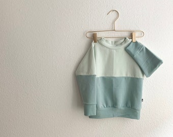 pastel color block sweater in dusty mint and chalk gray blue