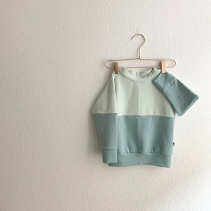 pastel color block sweater in dusty mint and chalk gray blue