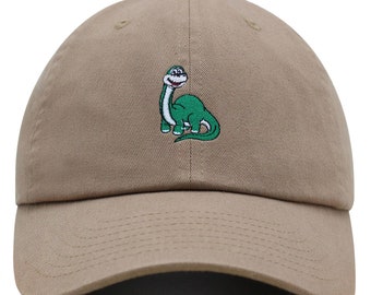 May include: A khaki baseball cap with an embroidered green dinosaur on the front.