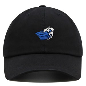 May include: A black baseball cap with a blue and white wave embroidered on the front.