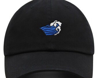 May include: A black baseball cap with a blue and white wave embroidered on the front.