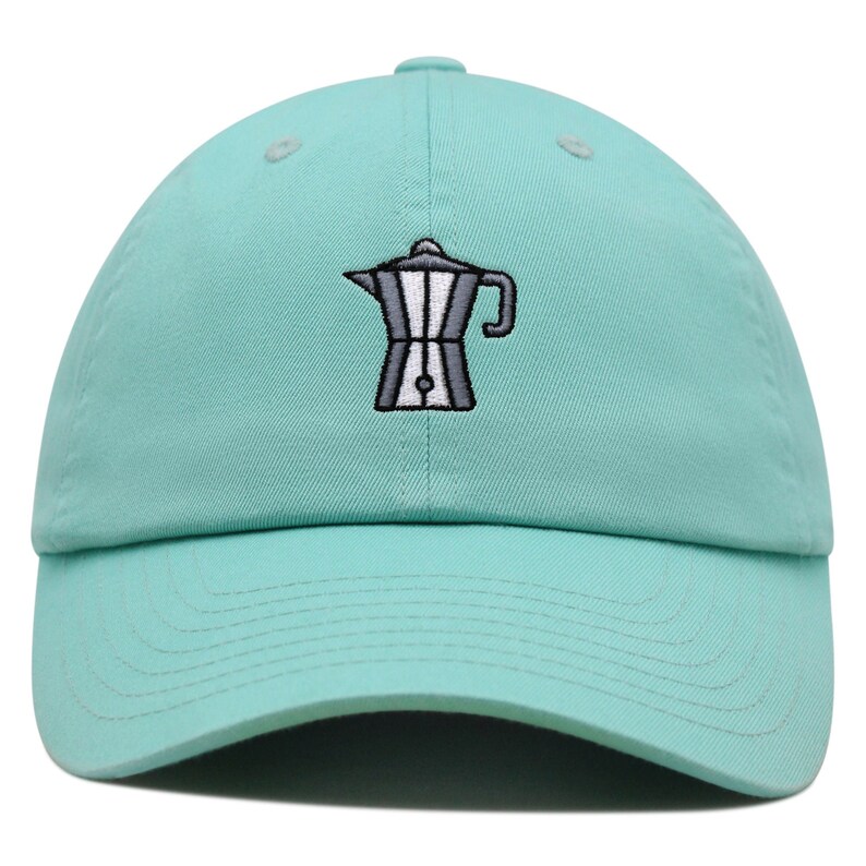 May include: A light blue baseball cap with an embroidered image of a silver coffee pot.