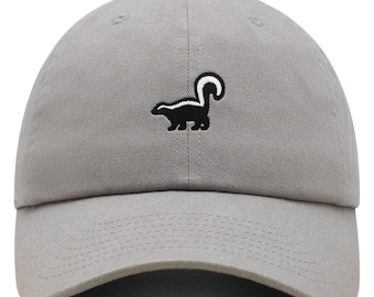 May include: A gray baseball cap with a black and white embroidered skunk design.