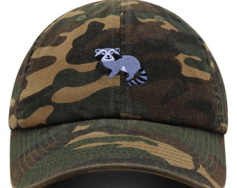 May include: A camouflage baseball cap with an embroidered raccoon design.
