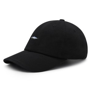 May include: Black baseball cap with a curved brim. The cap features a small embroidered fish on the front. The hat is made of a soft fabric and has a classic, casual style.