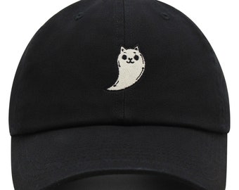 May include: A black baseball cap with a white embroidered ghost with a cat face on the front.