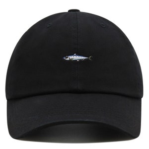 May include: Black baseball cap with a small embroidered fish design in shades of blue, white, and yellow. The cap has a curved brim and a classic six-panel construction. A casual accessory for everyday wear.