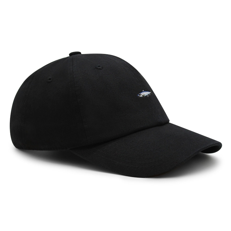 May include: Black baseball cap with a curved brim. The cap features a small embroidered fish design on the front. The cap is made of a durable fabric and has a classic, casual style.