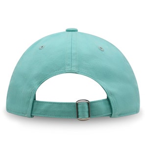 May include: A light blue baseball cap with an adjustable strap and buckle closure.