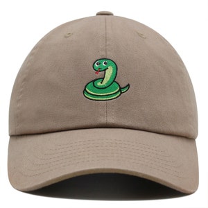 May include: A khaki baseball cap with an embroidered green snake with a red tongue and black eyes.