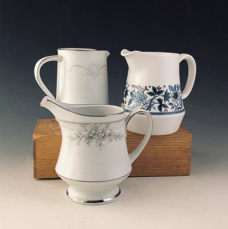 Collection of three lovely little china pitchers