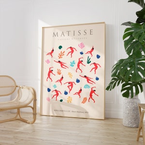 Puede incluir: Un p&oacute;ster con una ilustraci&oacute;n colorida de bailarines en rojo, azul, verde y amarillo. El texto "MATISSE PAPIERS DECOUPES BERGGREEN & CIE - Henri Matisse, 1953" est&aacute; en la parte inferior del p&oacute;ster.