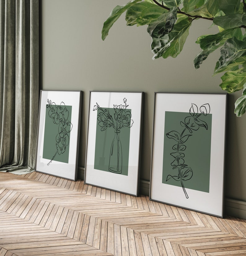 Set of three botanical line art prints: orchid sprig, bouquet in a bottle, and eucalyptus stem; black lines on white with sage-green blocks, minimalist scandi look.