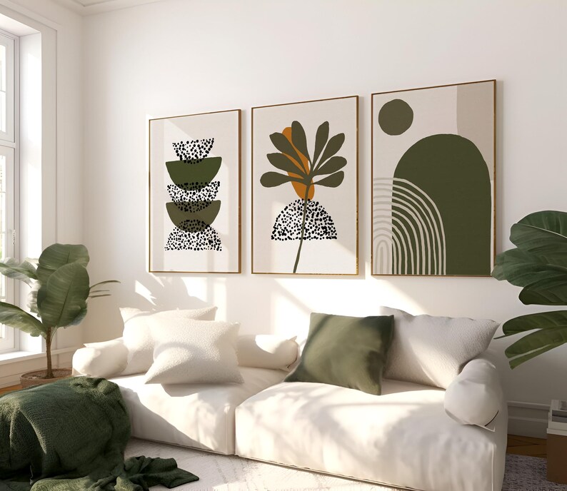 May include: Three abstract art prints with a green, brown, and white color scheme. The prints feature geometric shapes, a stylized plant, and a curved line design.