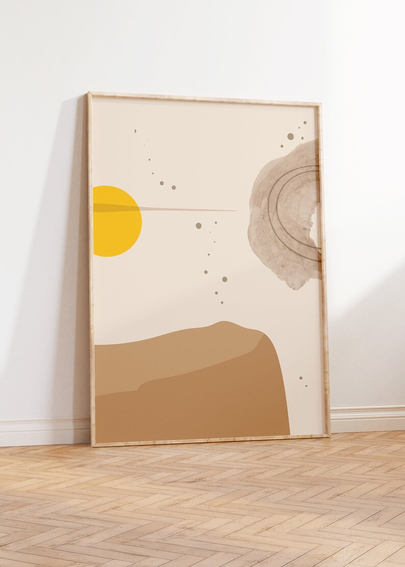 May include: Abstract art print in a wooden frame with a yellow circle, brown shapes, and gray dots on a beige background.
