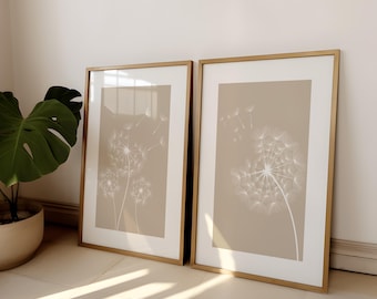 Juego de 2 impresiones de diente de león para pared, con estampados botánicos minimalistas en tonos neutros suaves.