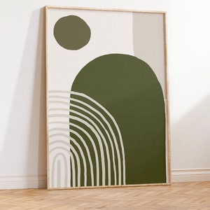 May include: Abstract art print with a green, beige, and white color scheme. The print features a large green circle with a smaller green circle and a beige rectangle in the background. The print is framed in a light wood frame.