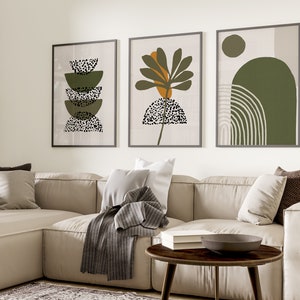 May include: Three framed abstract art prints with a green, brown, and white color scheme. The prints feature geometric shapes and patterns.